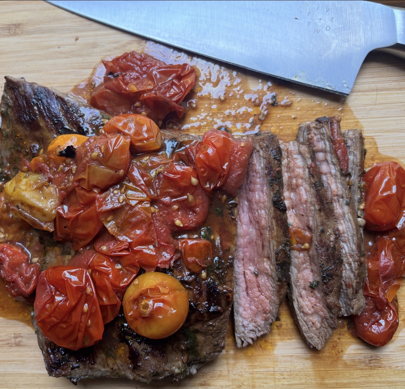 The best grilled flank steak w/roasted cherry tomatoes and chimichurri