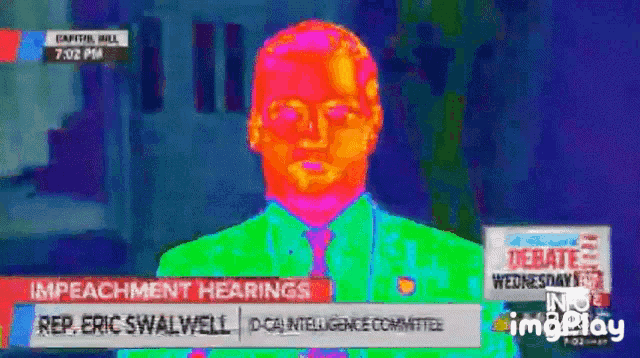 Thermal camera GIF of Eric Swalwell at impeachment hearings, lighting up like a heat-map volcano the moment he allegedly drops a political “sound effect” on live TV.