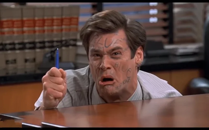 Jim Carrey courtroom scene holding blue pen from Liar Liar