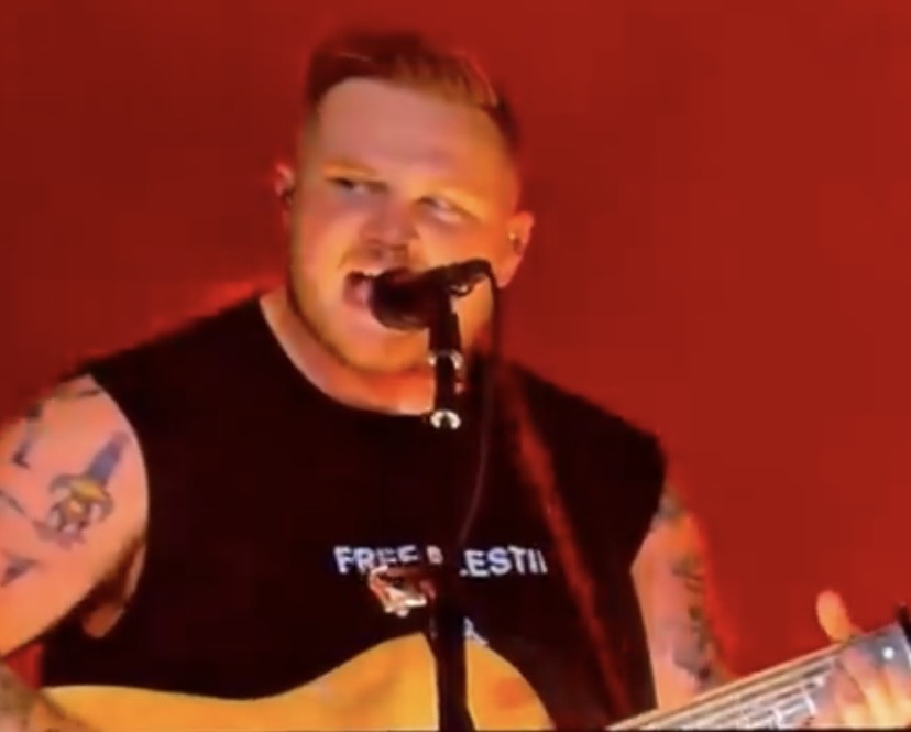 Zach Bryan wears ‘Free Palestine’ shirt at Gillette Stadium and fan reaction pours in.